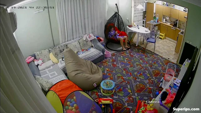 IPCAM – European girl gets dressed in the living room IPCAM – European girl gets dressed in the living room